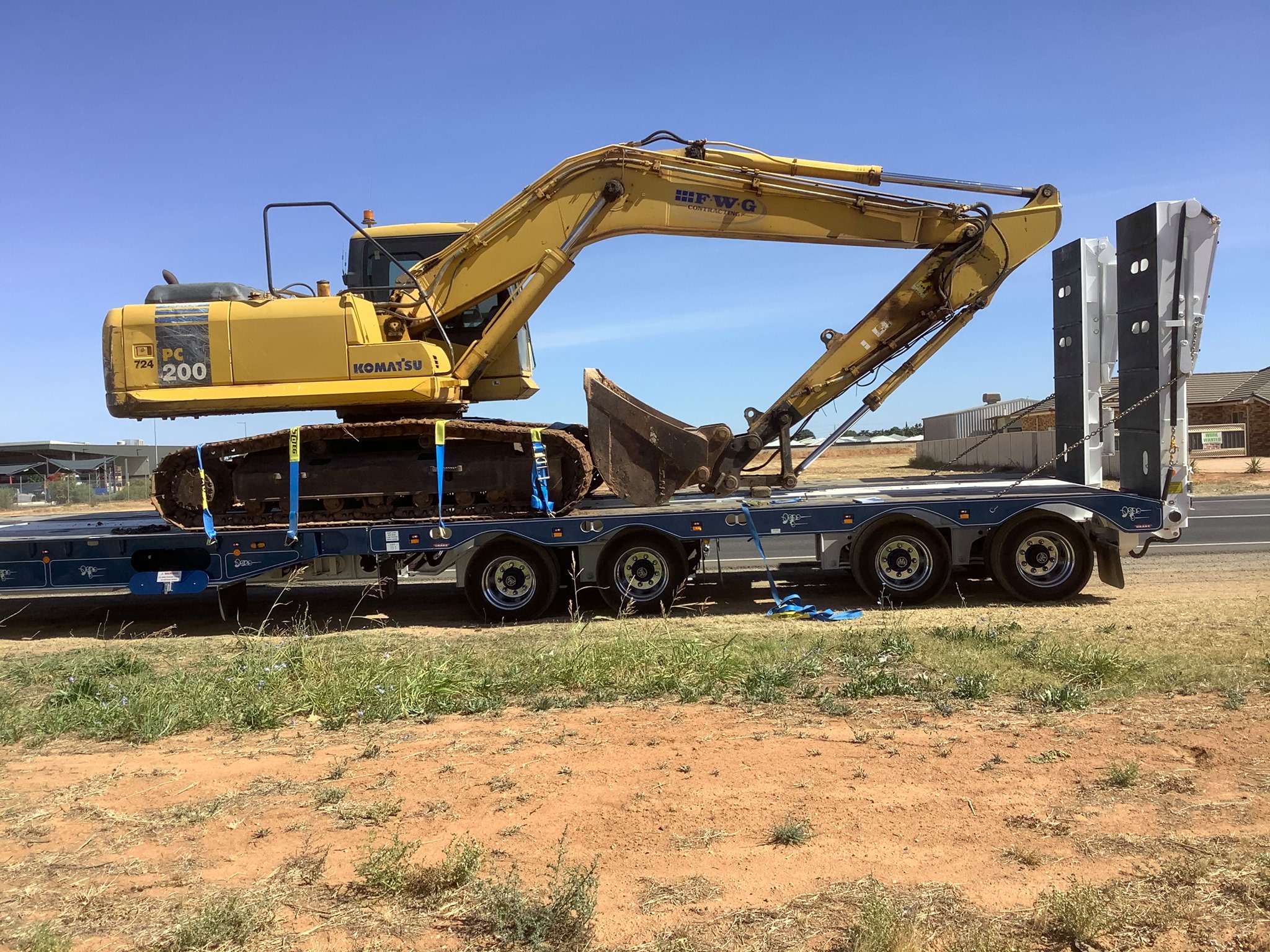 Excavator with unsafe straps