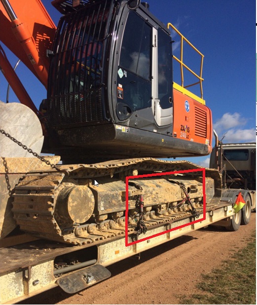 A heavy low loader combination loaded with a 25-tonne excavator.