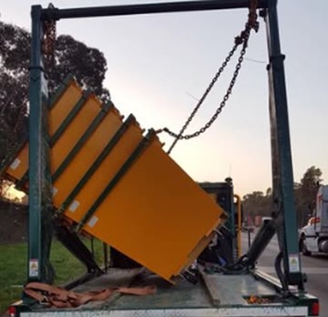A heavy low loader combination loaded with a 25-tonne excavator.